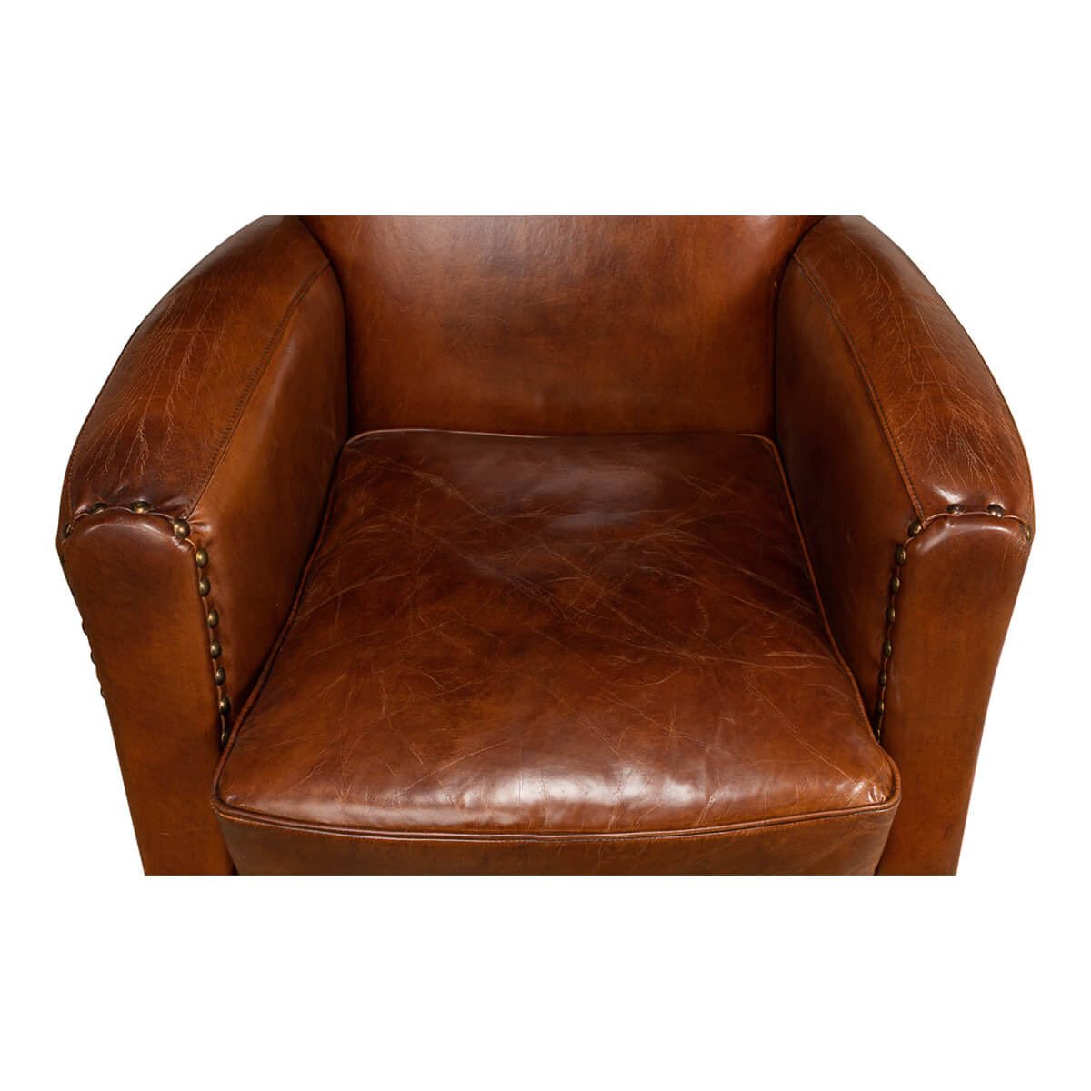 Overhead view of brown leather armchair seat.
