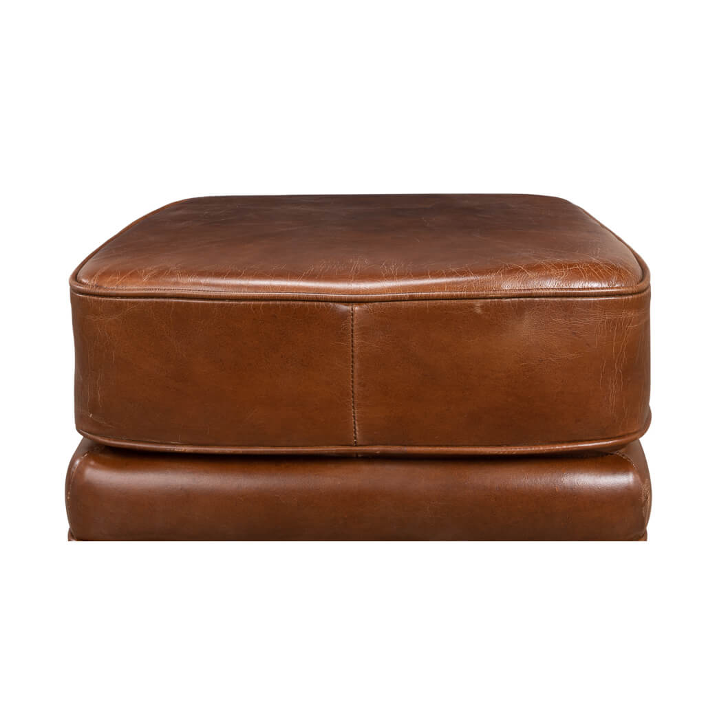Top view showcasing the leather ottoman's smooth surface.