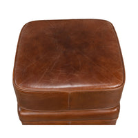 Aerial view of square leather ottoman design.