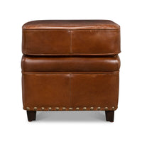 Front view of leather ottoman with wooden legs.