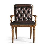 Leather tufted dining armchair front view.