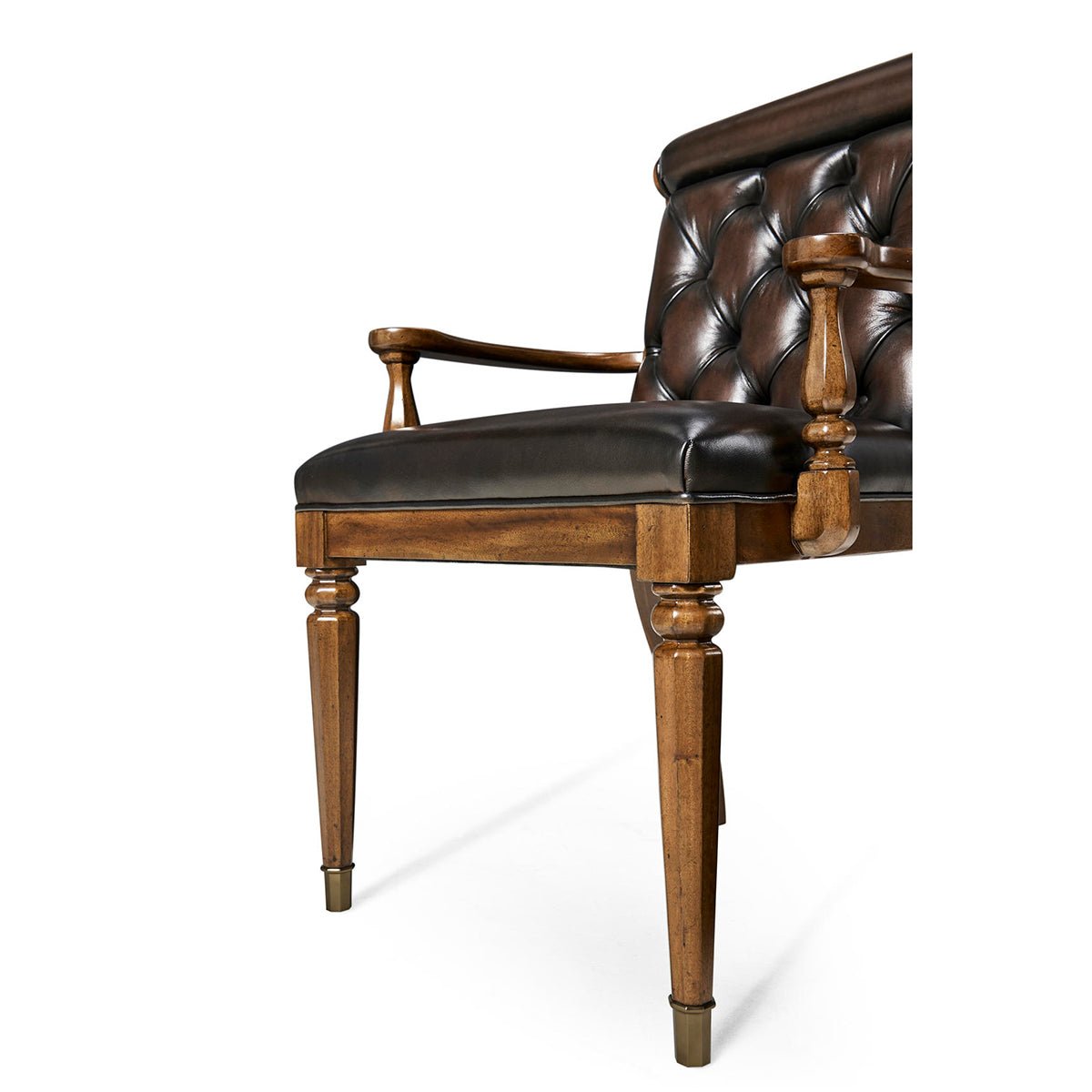 Detailed armrest and leg of dining armchair.