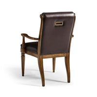 Leather tufted dining armchair back view.