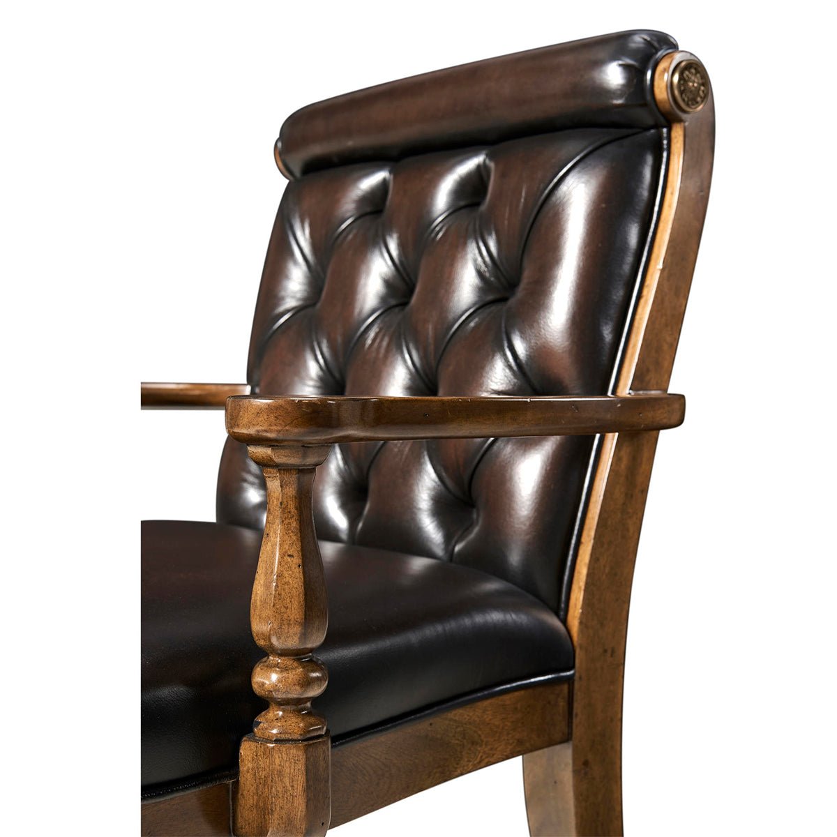 Close up of leather tufting on dining armchair.