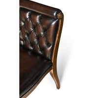 Top view, tufted leather backrest of classic dining chair.