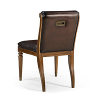 Back view, classic leather tufted dining chair with brass handle.
