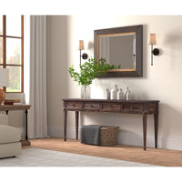 Console table under mirror in cozy living room scene.