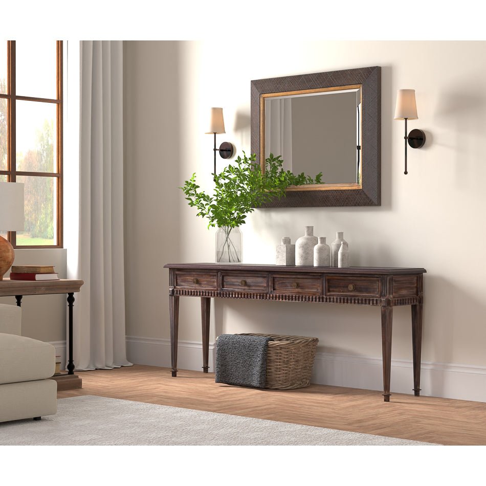 Console table under mirror in cozy living room scene.