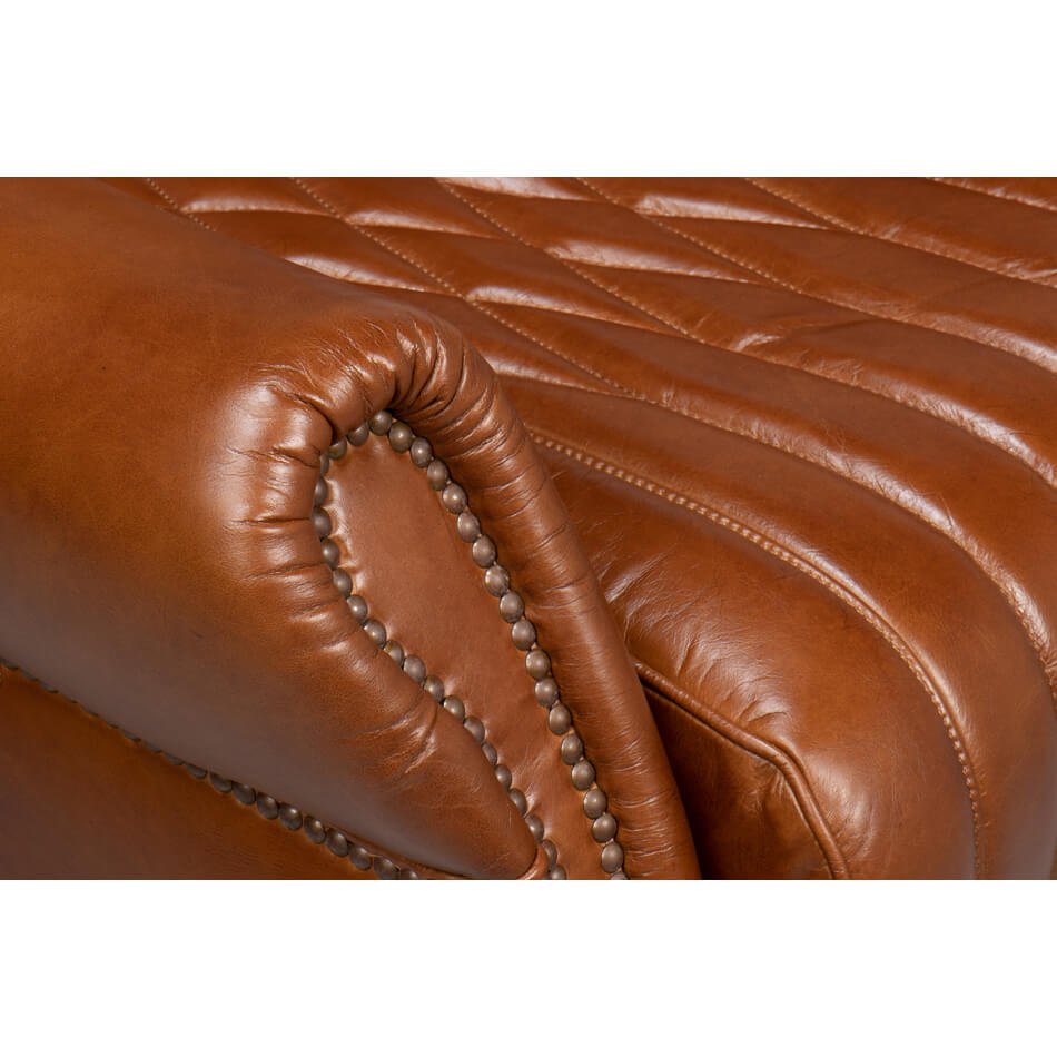 Leather chair armrest details, close-up view.