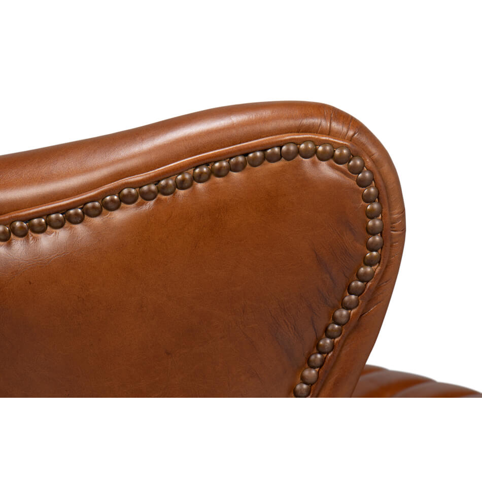 Wingback chair top corner, nailhead trim detail.