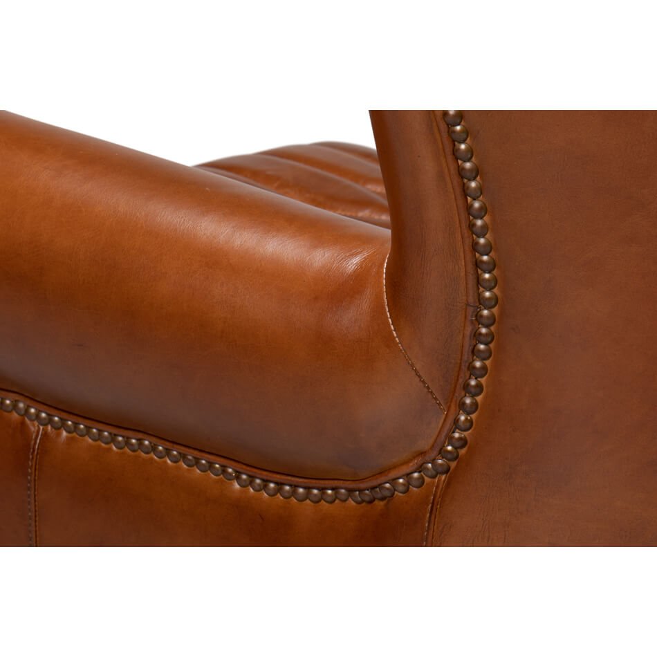 Leather chair armrest, stitching and trim detail.