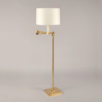 Modern brass floor lamp, front view.