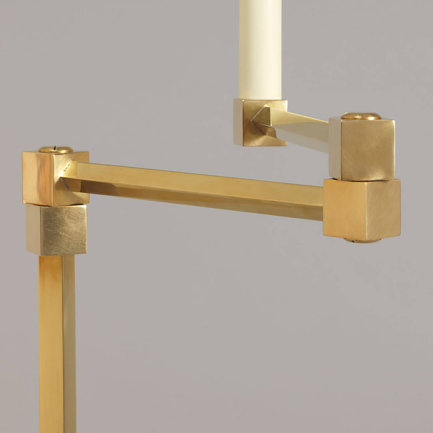 Close-up of brass joint on floor lamp.
