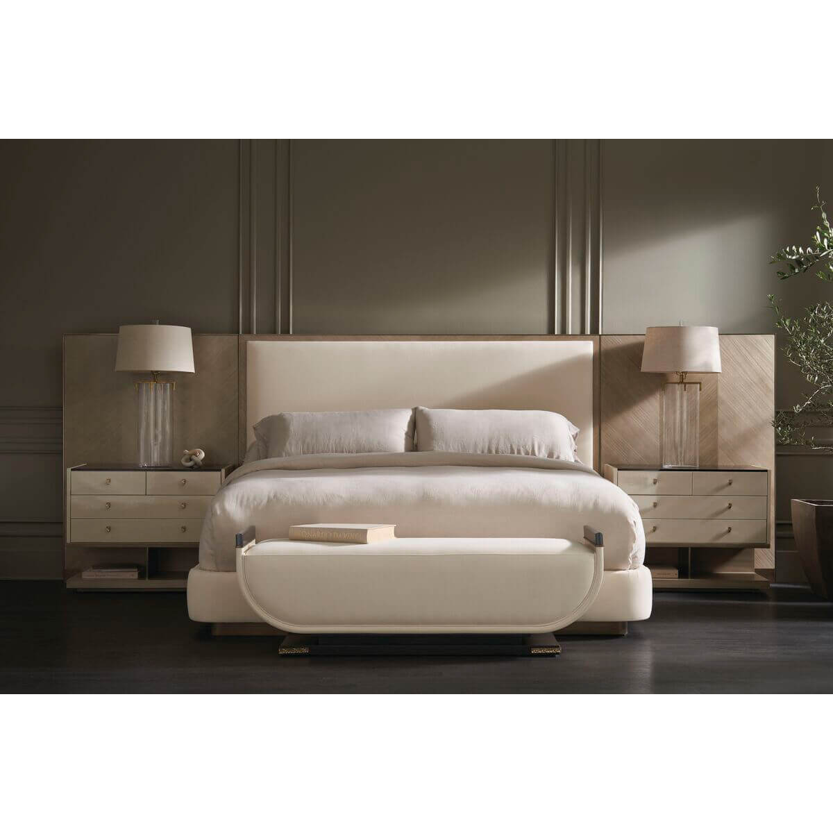 Bedroom scene featuring upholstered queen bed with decor.