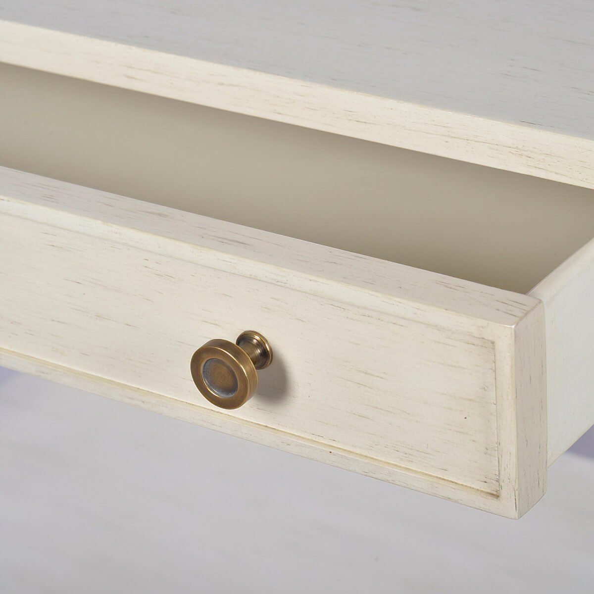 Close-up of drift white nightstand drawer and knob.