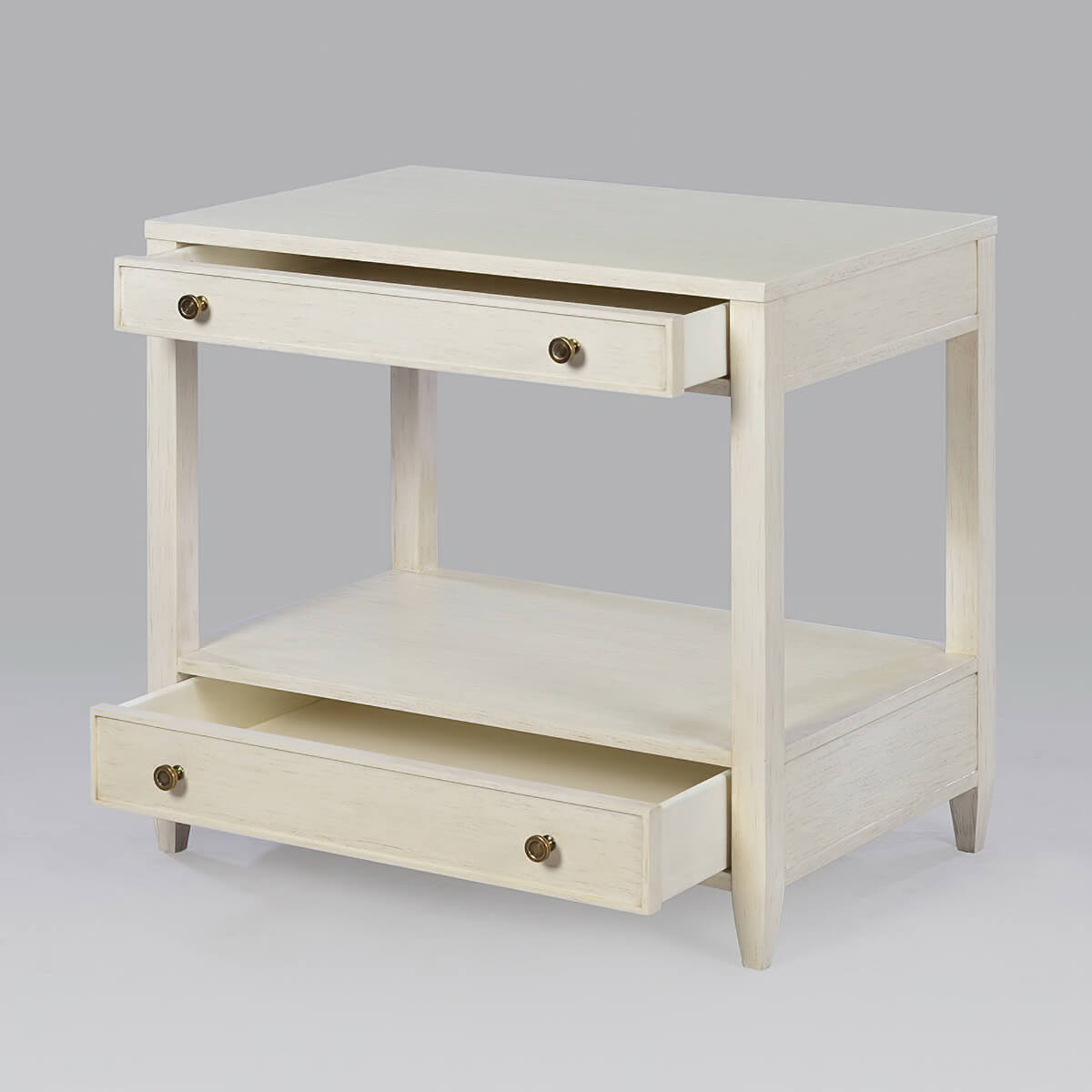 Drift white nightstand with open drawers, side view.