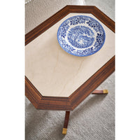 Close-up of accent table with blue decorative plate.
