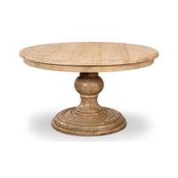 Round wooden pedestal dining table front angle view.