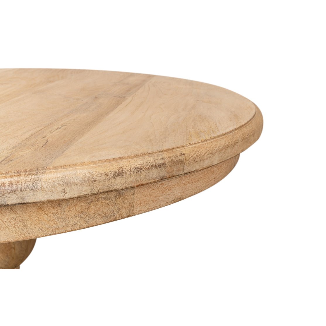 Close-up of round dining table edge detail.