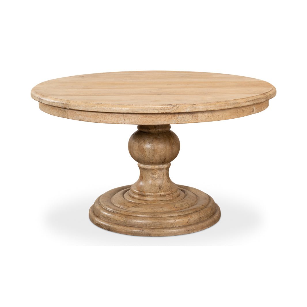 Wooden dining table side angle, round pedestal base.
