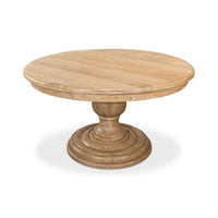 Angled view of round pedestal dining table.