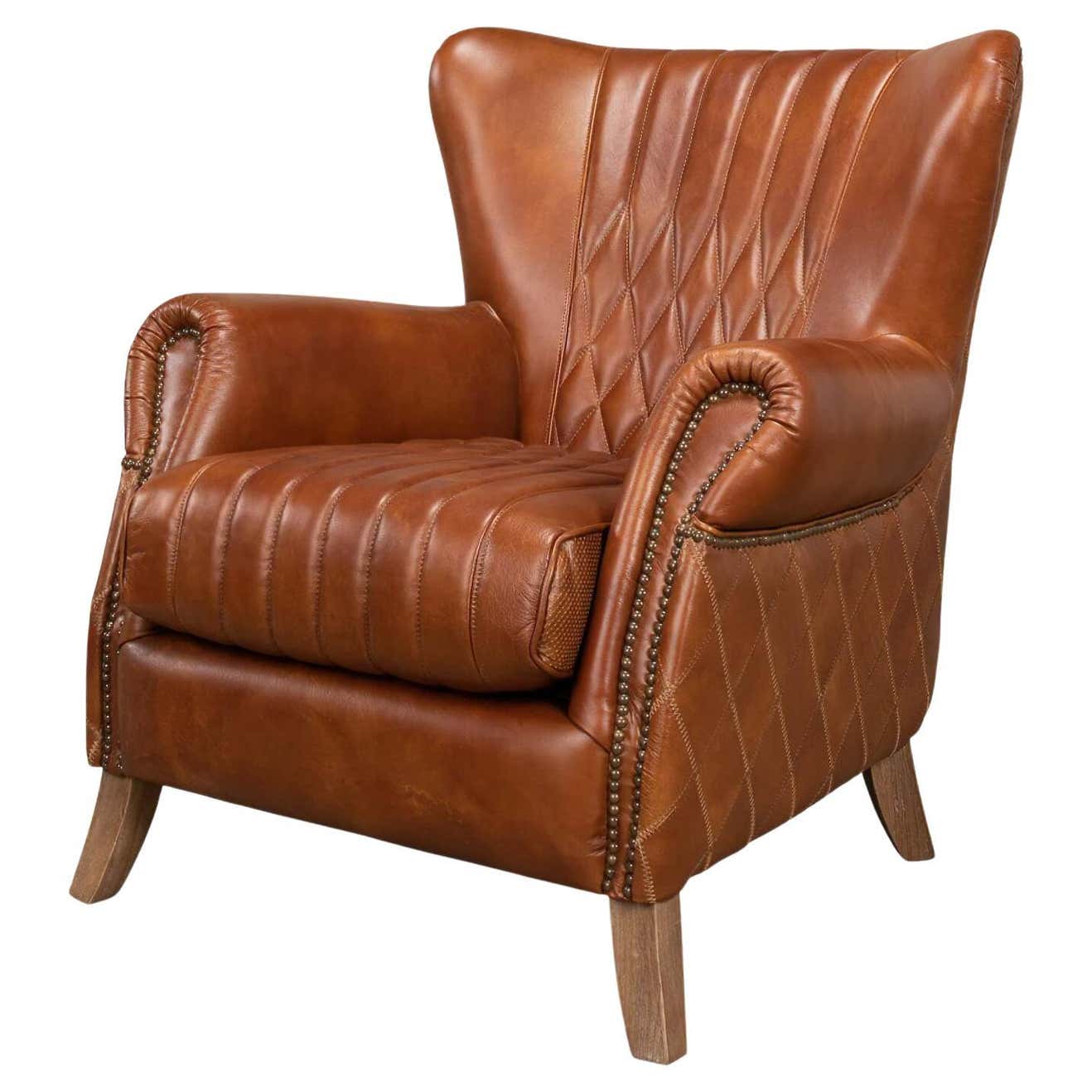 Brown leather armchair with quilted pattern, front view.