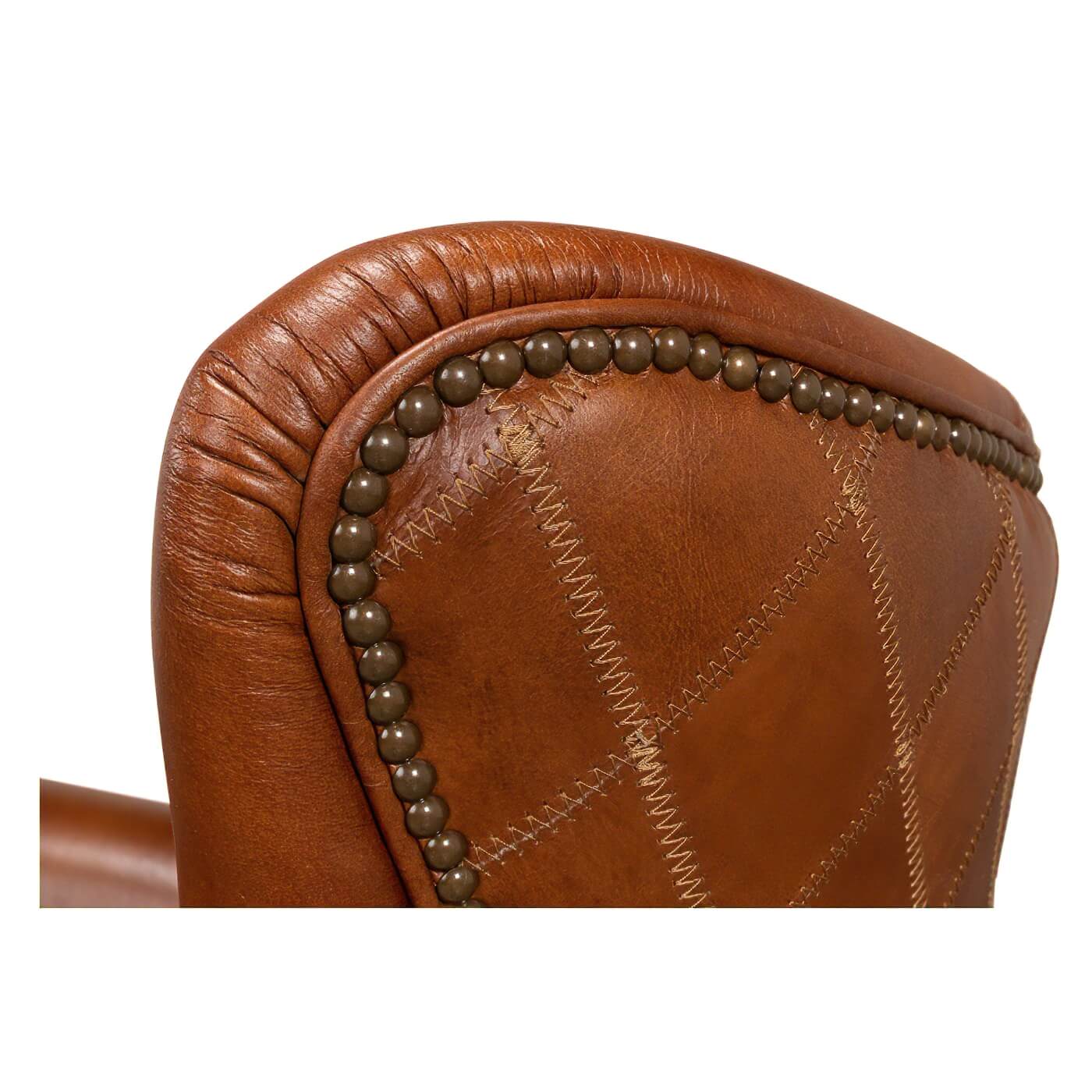 Back top corner stitching detail on leather armchair.
