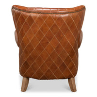 Back view of quilted brown leather armchair.