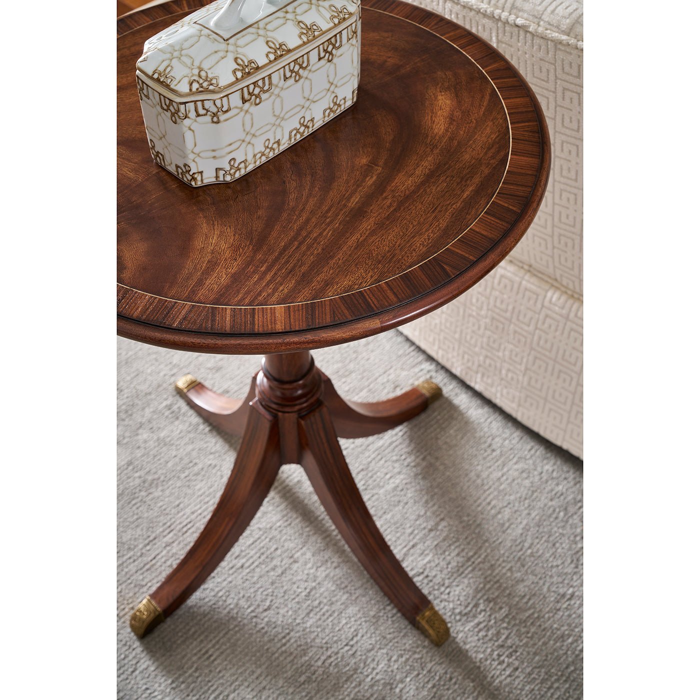 Top view of wooden classic round accent table with box.
