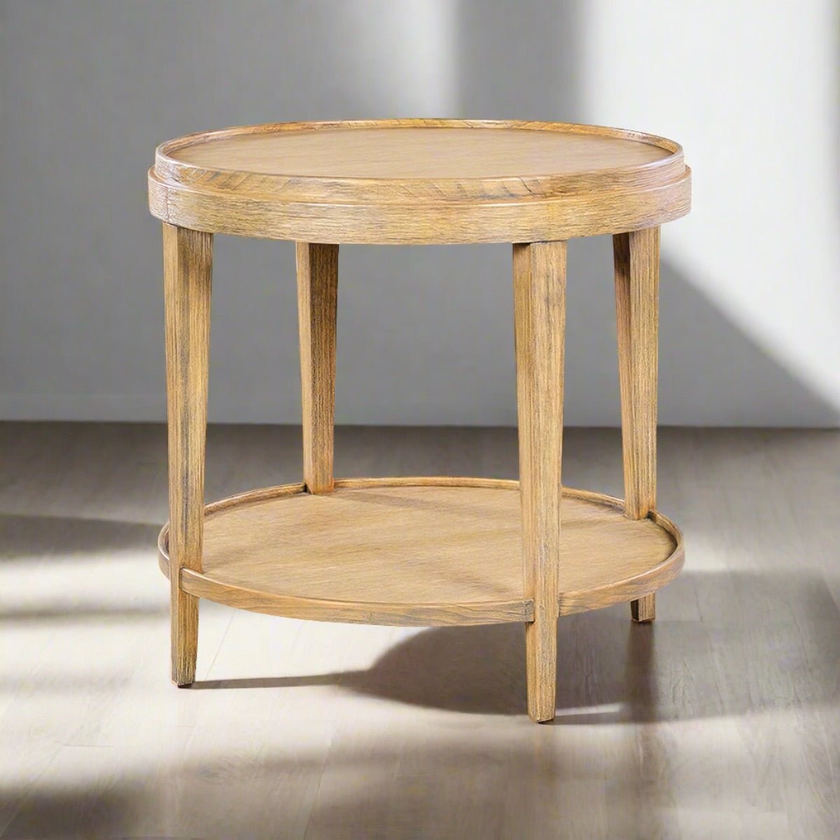 Round end table, staged, natural light, interior setting.