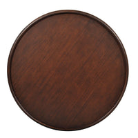 Top view of round mahogany end table surface.