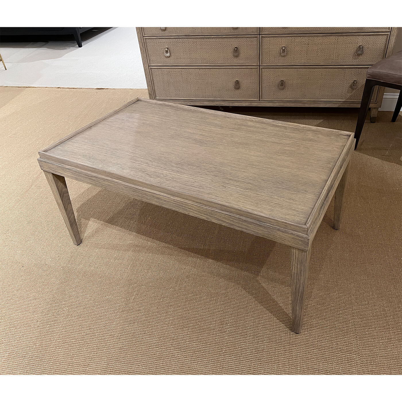 Rustic coffee table placed on a beige carpet.