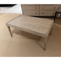 Rustic coffee table placed on a beige carpet.