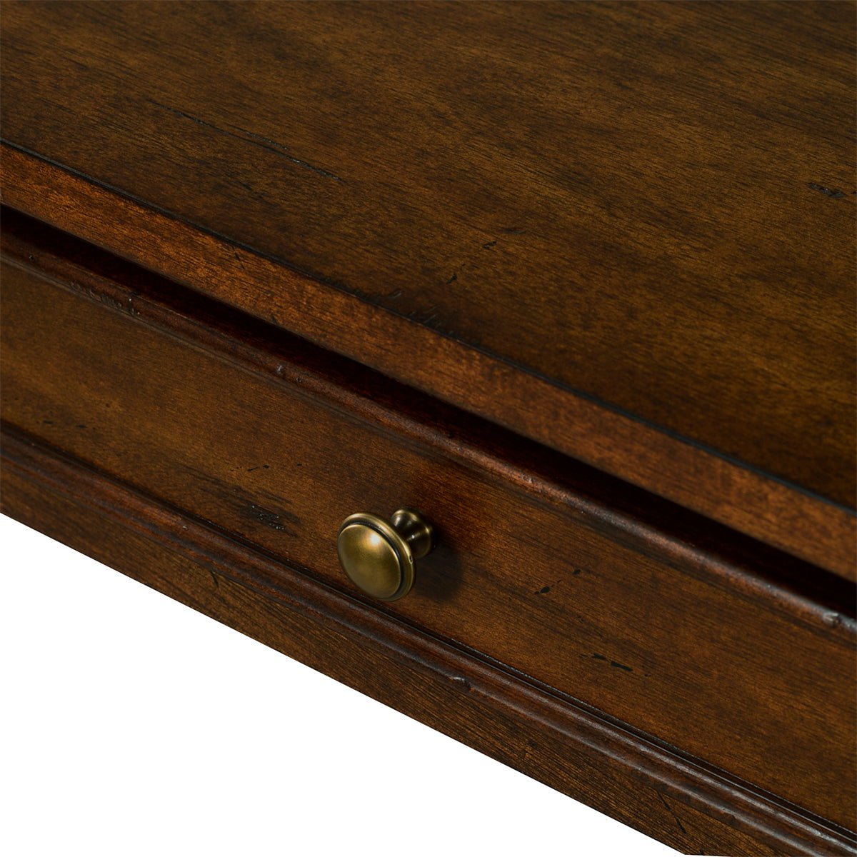 Console table drawer close-up, brass knob detail.