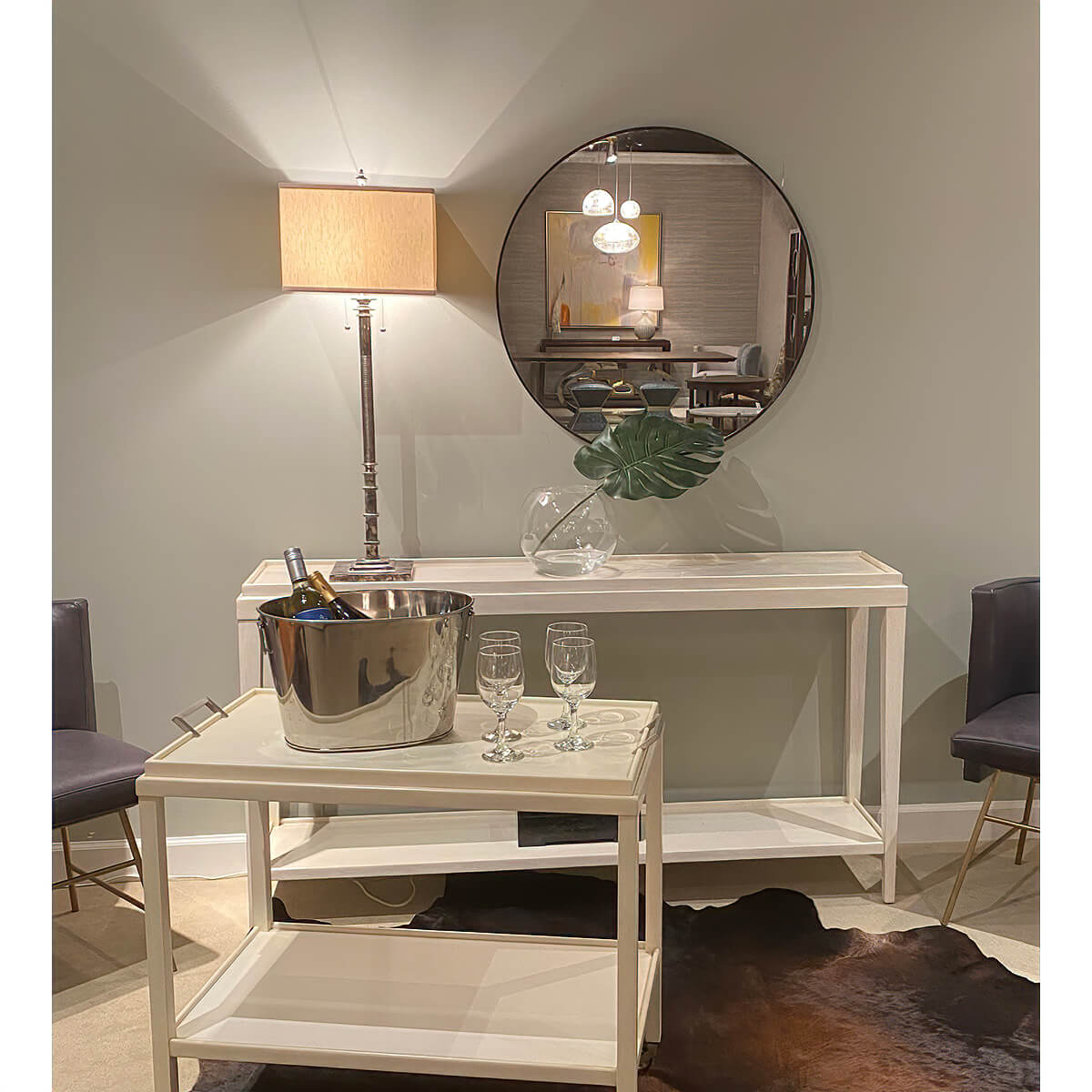 Console table styled with lamp and mirror in decor.