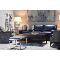 Dark coffee table in contemporary living room with sofa.