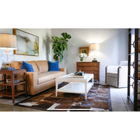 White lacquer coffee table in living room setup.