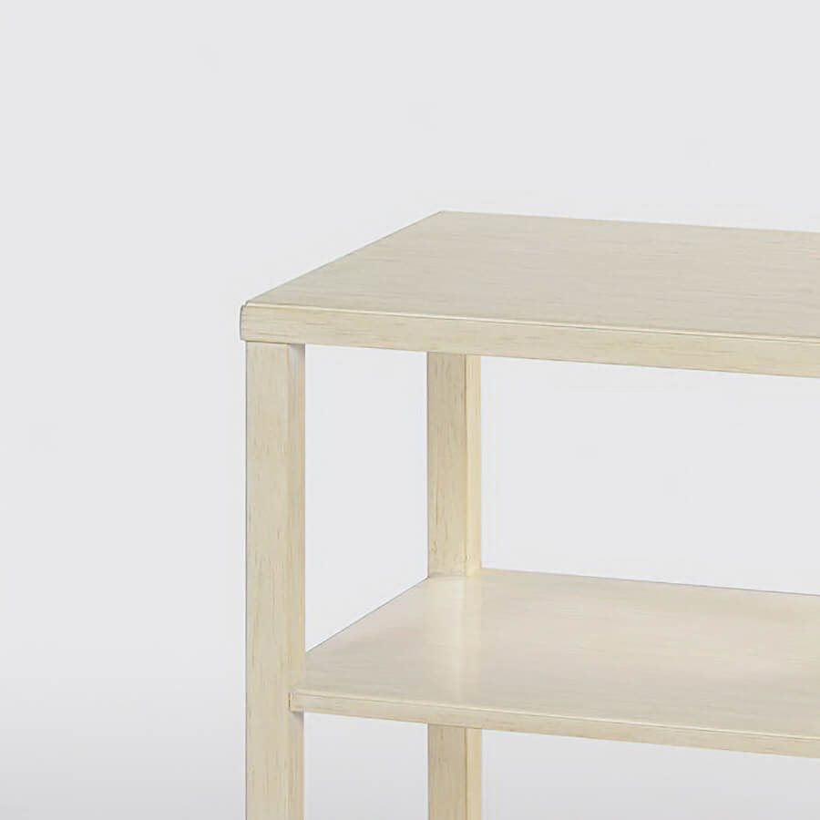 Close-up on corner, three-tier side table.