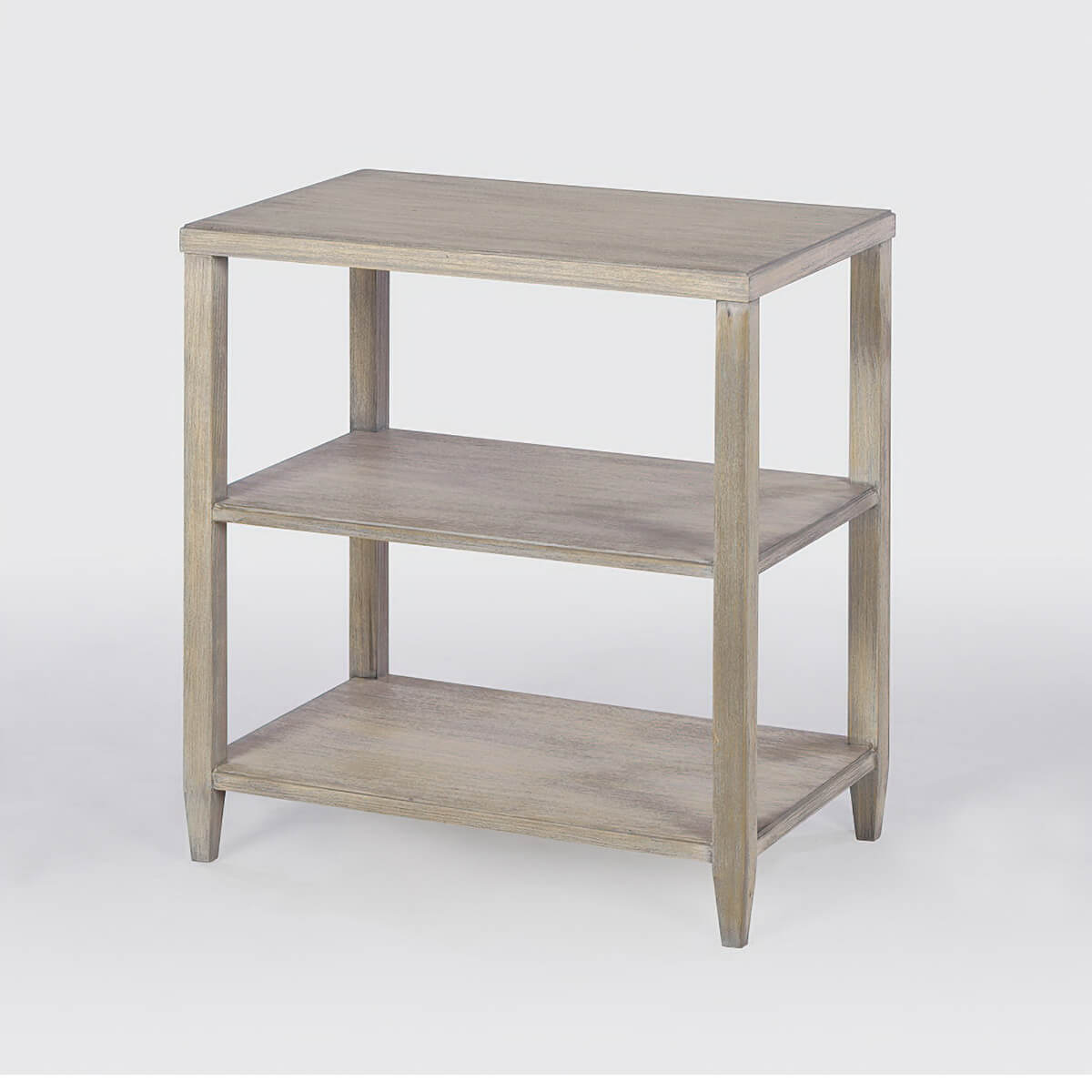 Greyed three-tier side table, angled view.