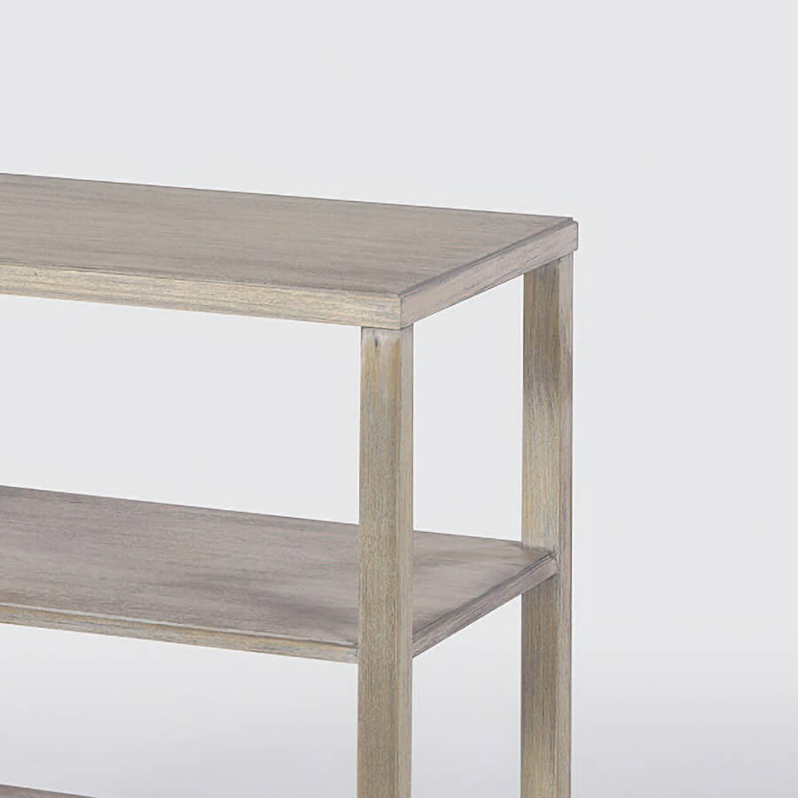 Close-up of greyed side table top and shelves.