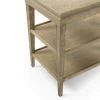 Close-up of legs on three-tier side table.