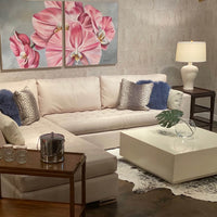 Living room with side table, placed by cozy sofa.