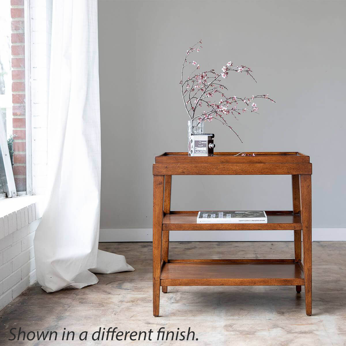 Side table in room, different finish, decor style.