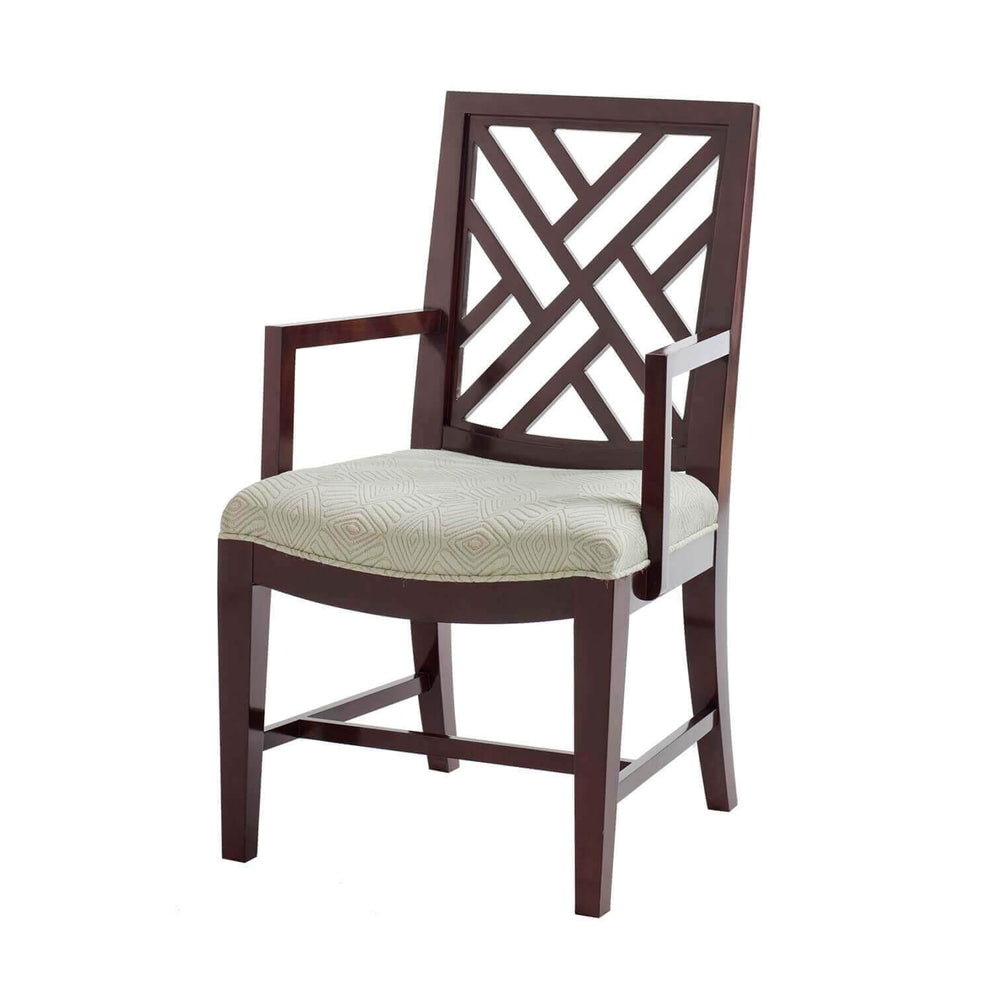 Wooden dining armchair with trellis back and cushion.