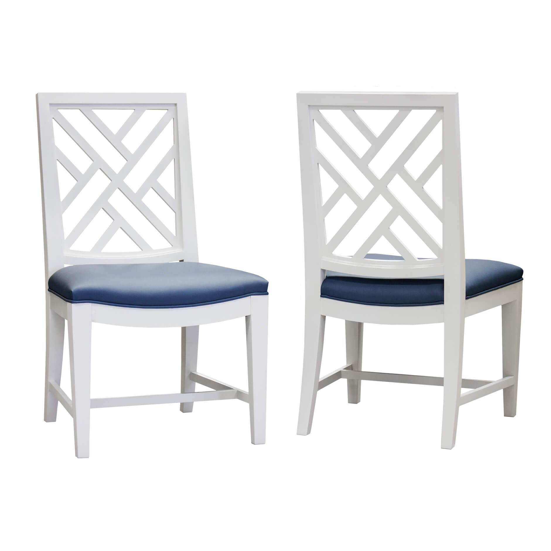 Pair of white dining chairs with trellis backs, blue seats.