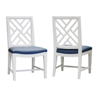 Pair of white dining chairs with trellis backs, blue seats.