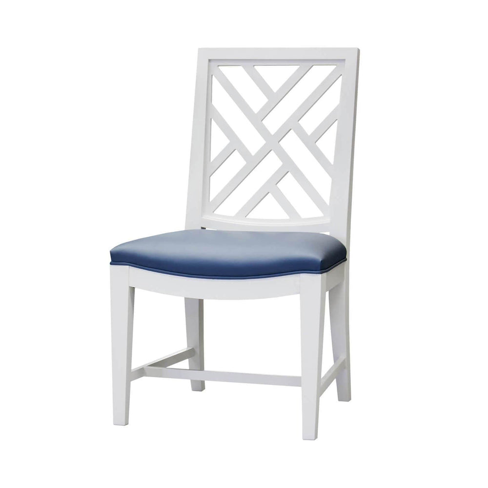 White dining chair with blue cushion, trellis back design.