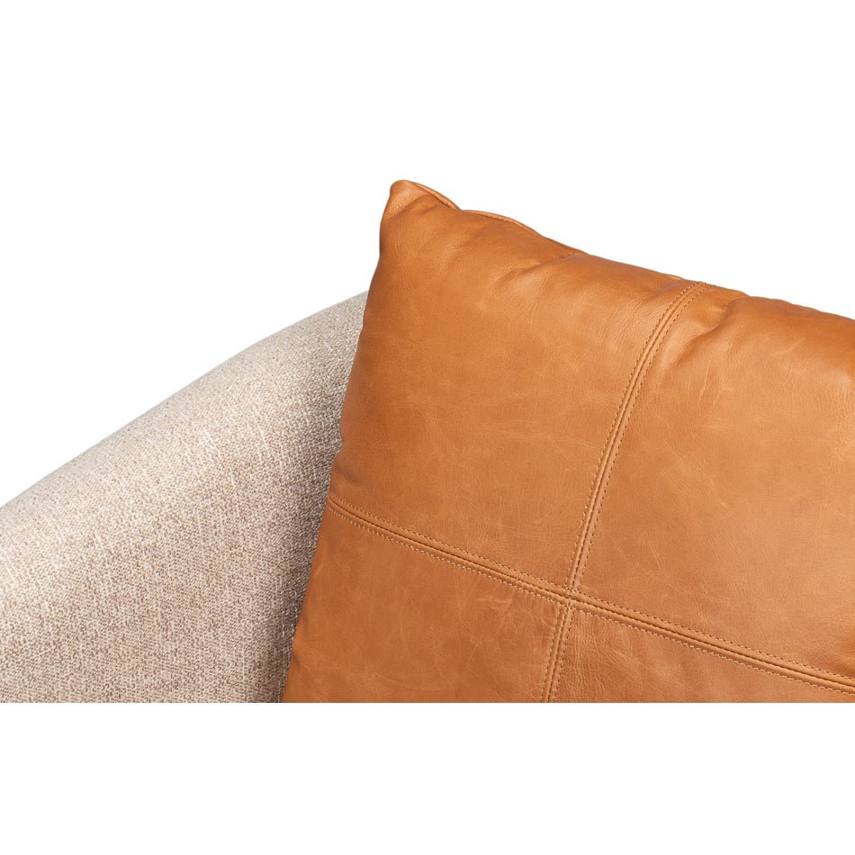 Leather pillow close-up on classic tub chair.