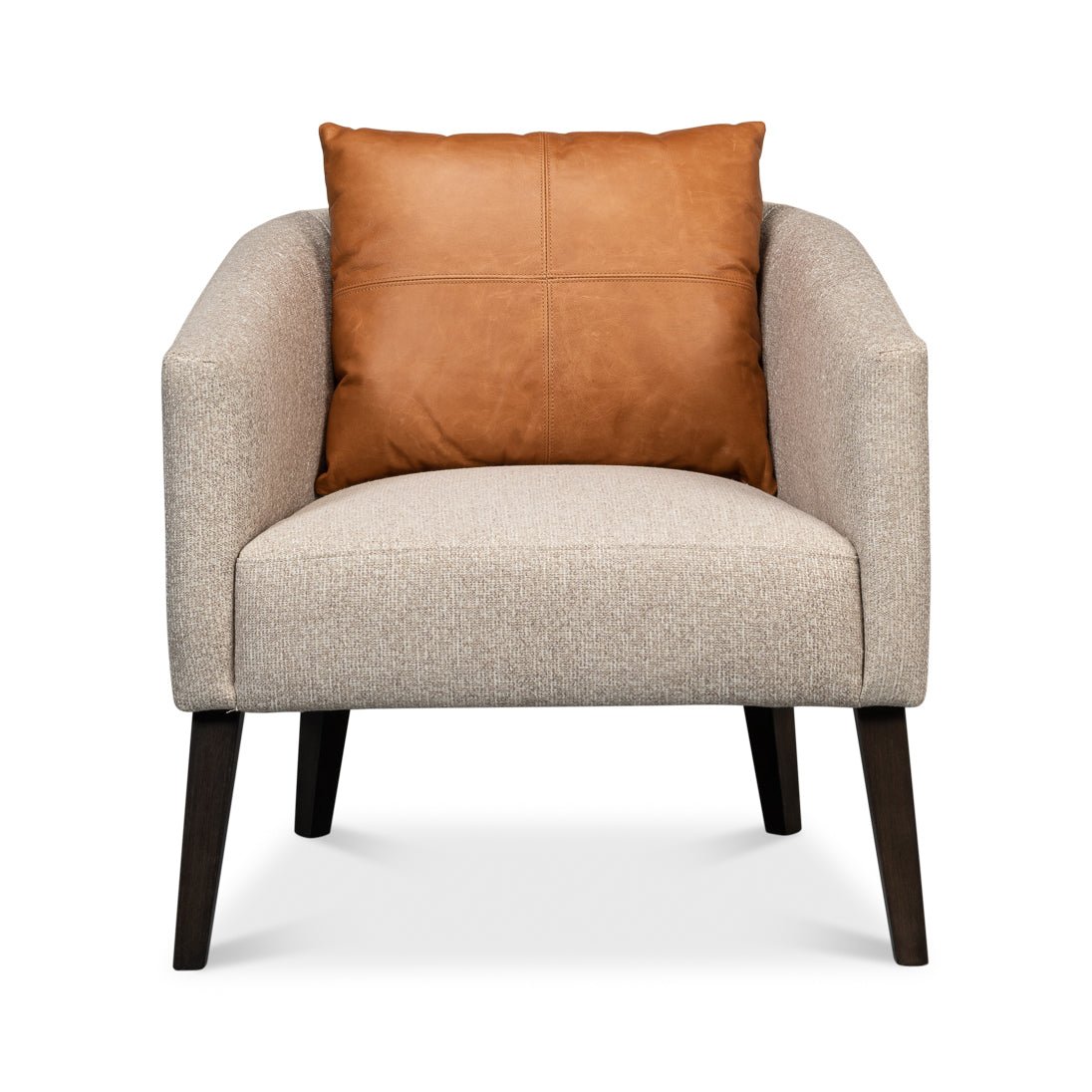 Classic tub chair front close-up with leather pillow.