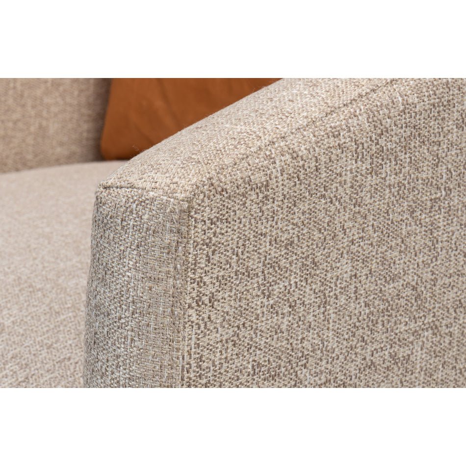 Close-up of classic tub chair armrest fabric texture.